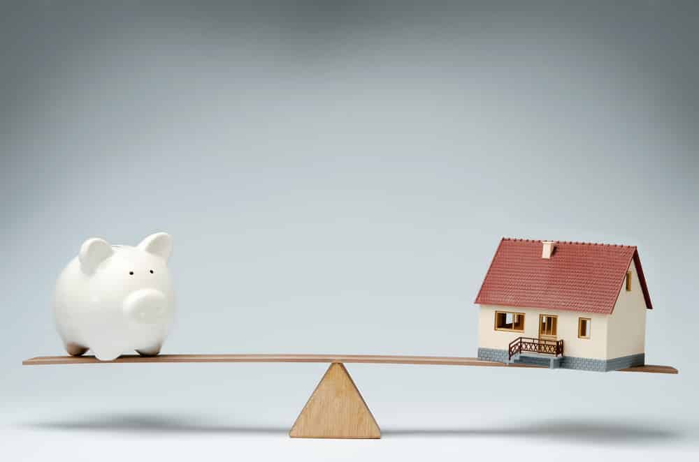 piggy bank and property balance